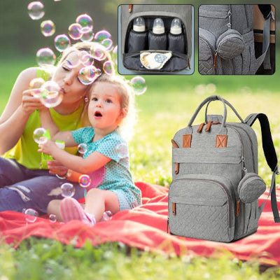 Sac à dos à langer maman fillette jouent aux bulles
